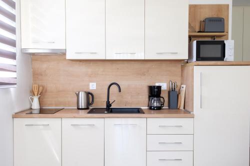 Η κουζίνα ή μικρή κουζίνα στο Apartments Grape