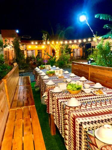 a group of tables with plates of food on them at Rosa Garden in Ninh Binh