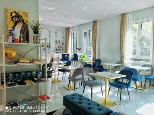 a restaurant with tables and chairs in a room at CSI Group - Hotel Central Station in Milan