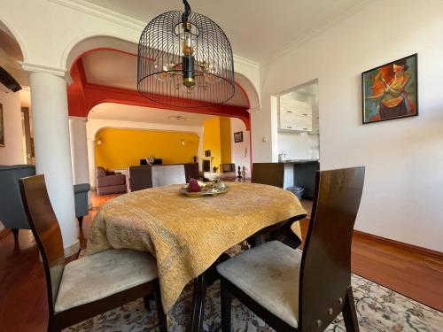 a dining room with a table and chairs at Central Exclusive Apartment/Penthouse in Bitola