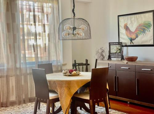 a dining room with a table with a chicken on it at Central Exclusive Apartment/Penthouse in Bitola