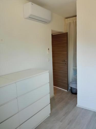 a room with a chest of drawers and a closet at Apartment Valentino in Vabriga