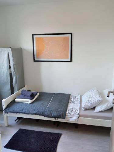 a bed in a room with a picture on the wall at Apartment Valentino in Vabriga