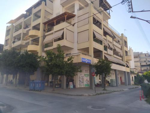 a large building on the corner of a street at Deluxe Lodge in Volos