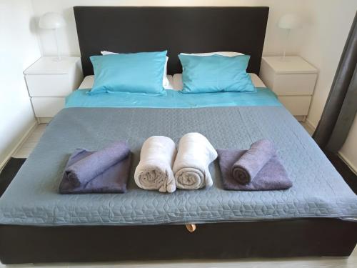 a group of towels are arranged on a bed at Apartment Valentino in Vabriga