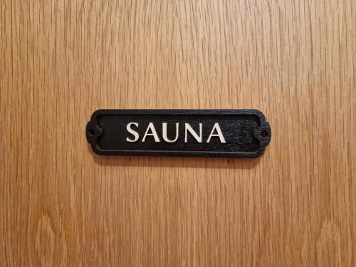 a black sign that says samurai on a wooden door at The Lodge at Bad Gastein in Bad Gastein