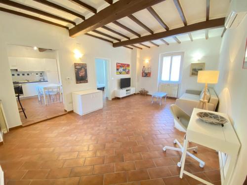 a living room with a couch and a table at BnBetter - Apartment Teddy, near the Train Station to Florence in Prato