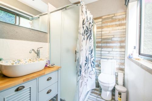 a bathroom with a sink and a toilet at הים פוגש את ההר- בית בלב הגליל Sea & Mount in Adamit