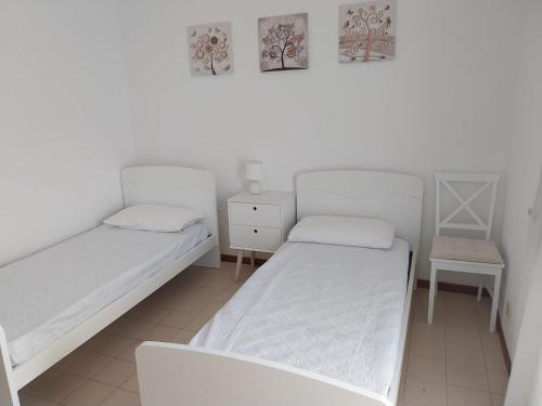 Postel nebo postele na pokoji v ubytování Appartamento a Fregene vicino Servizi e Mare