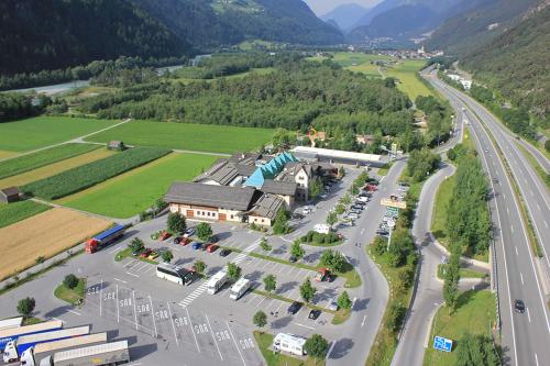 an aerial view of a parking lot next to a road at Alpenrast Tyrol in Mils bei Imst