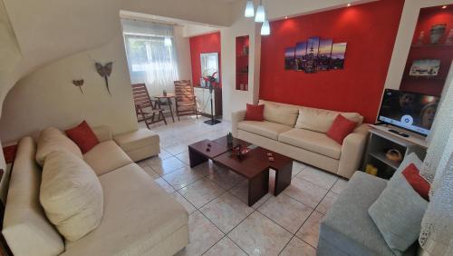 a living room with a couch and a table at Modern Sea Villa in Leptokaria in Leptokaria