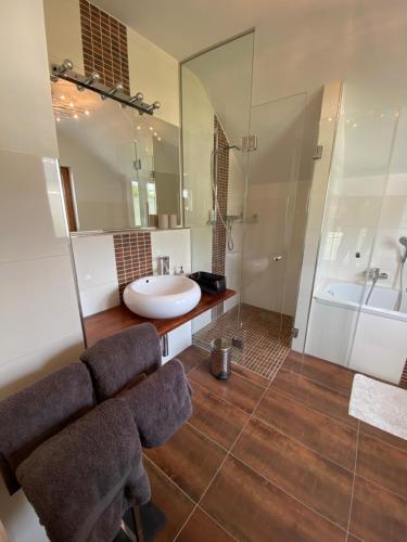 a bathroom with a sink and a mirror at Megina Lodge in Mayen