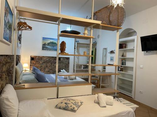 a room with a bed and a table in it at Salu’ in Taormina