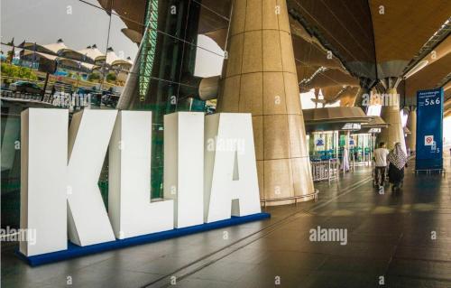 a large white sign in a shopping mall at La Suite@Alanis Residence in Sepang
