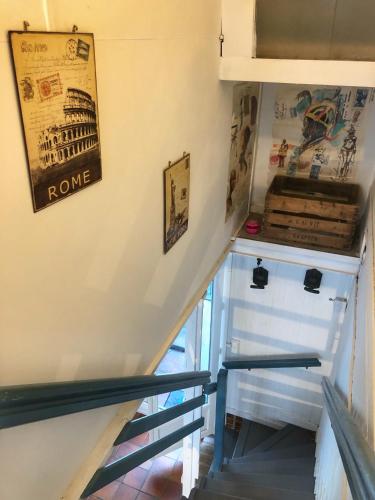 a stairway leading up to the basement of a house at La plage in Fécamp