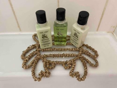 a group of three bottles of essential oils on a tub at Click! Casa Lamartine Fabulous Ideal Location Walk to ALL!!! in Cassis