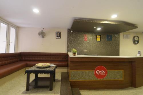 a living room with a couch and a counter at Hotel Kathir Palace in Madurai