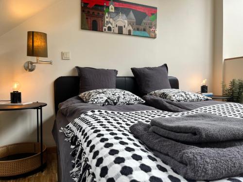 a bedroom with two beds with pillows on them at Ancien Cinema Loft in Vianden