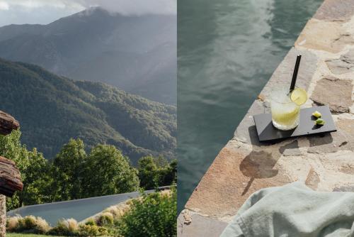 a drink on a table on a ledge with a view of water at SOLO PALACIO - Boutique Hotel & Spa in Llanuces