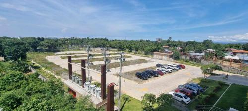 an aerial view of a parking lot with cars parked at Ohana Suites Lapu-Lapu City Condo Staycation Near Mactan International Airport in Lapu Lapu City