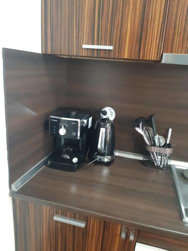 a coffee maker on a counter in a kitchen at The Castle Mansarde on the slope 7 - Pamporovo in Pamporovo
