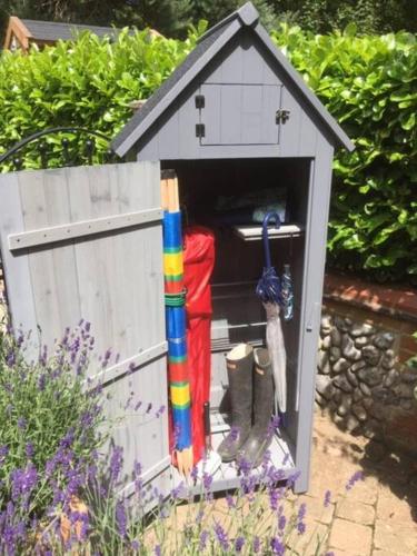 a small dog house with a rainbow flag in it at Cliff Lane Annexe: stylish in a perfect location. in Cromer