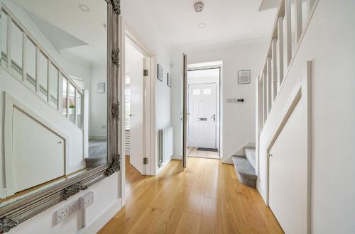 a hallway with a large mirror on the wall at 2 bed semi-detached house to rent in Connaught Road, Barnet EN5 in Barnet