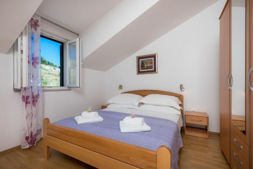 Posteľ alebo postele v izbe v ubytovaní Apartments Plazibat