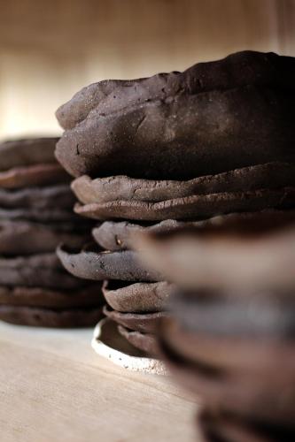 a stack of chocolate cookies sitting on a table at Aguamadera in Santa Eularia des Riu