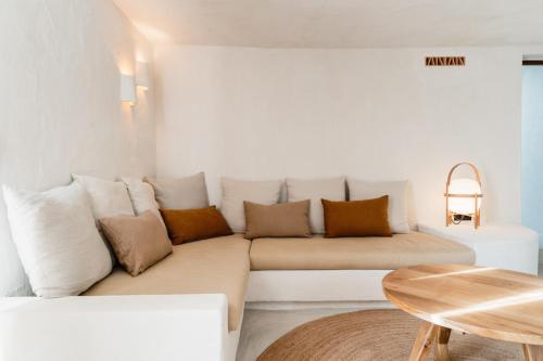 a living room with a couch and a table at Aguamadera in Santa Eularia des Riu