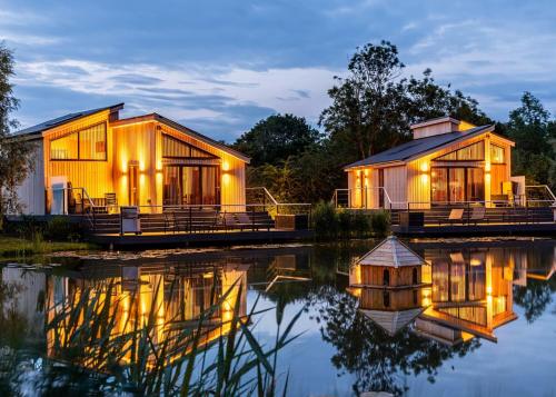 a house on the water at night at Amazing Home In Boston With Wifi in Boston