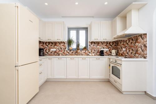 Η κουζίνα ή μικρή κουζίνα στο Nymphée Luxury Villas