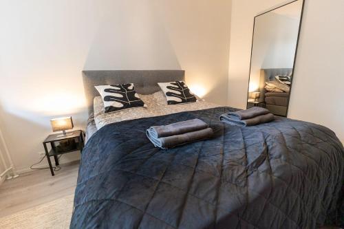 a bedroom with a large bed with two pillows on it at Apartment Naavis in Rovaniemi