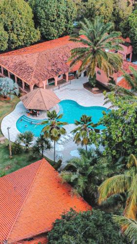 an aerial view of a resort with a swimming pool at Eco Pousada Paraíso dos Coqueirais in Japaratinga