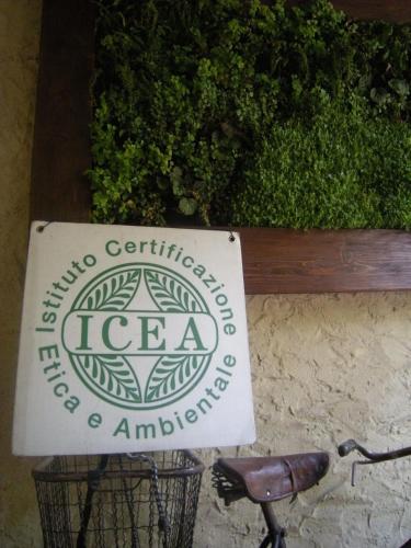 a sign for a tea company sitting next to a bike at Palazzetto Ardi in Torri di Confine