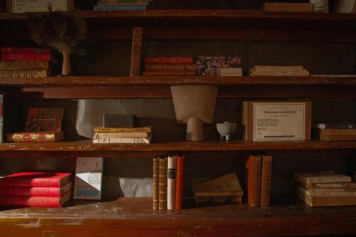 a book shelf filled with lots of books at Unique Boutique Hotel Antibes Juan-les-Pins in Antibes