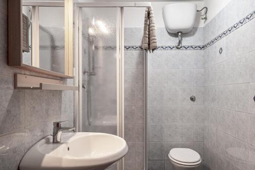 a bathroom with a shower and a sink and a toilet at (Loft in centro) Laboratorio dell’alabastro in Volterra