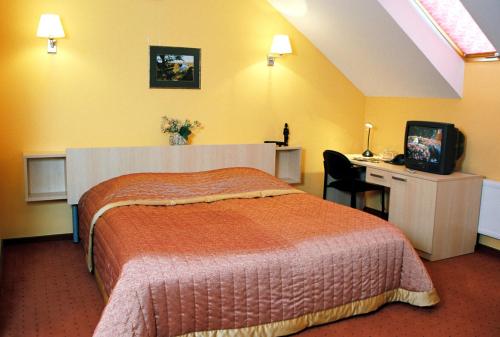 En eller flere senge i et værelse på Hotel Senas Namas
