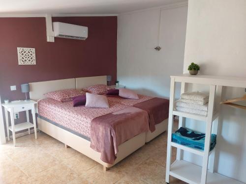 a bedroom with a bed and two night stands at Casa Josa in Ontinyent