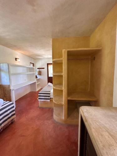 a room with two bunk beds in a room at La Conchita Tulum in Tulum