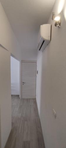 an empty room with a closet and a door at Al Duca San Pietro in Carloforte
