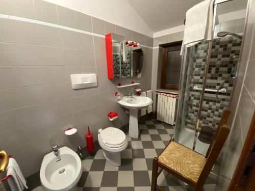 a bathroom with a sink and a toilet and a shower at Albergo Nazionale in San Giacomo