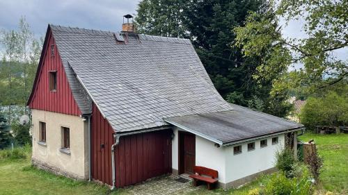 a red and white barn with a red roof at Chalupa Lučany in Lučany nad Nisou