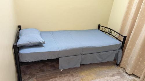 Un ou plusieurs lits dans un hébergement de l'établissement BabaJay Family Home