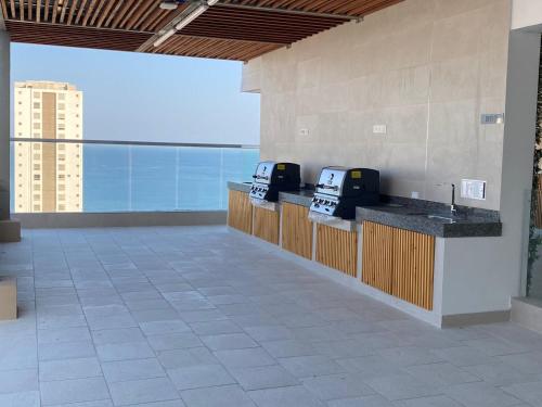 a lobby with a counter with two machines on it at El Samario Cumbia Host-Playa Salguero- Santa Marta in Gaira