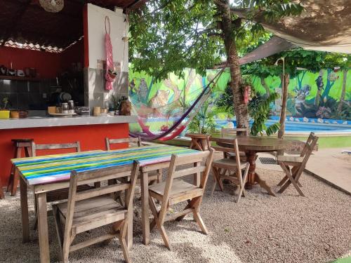 a group of tables and chairs in a restaurant at Zayali Bacalar - Guest House in Bacalar