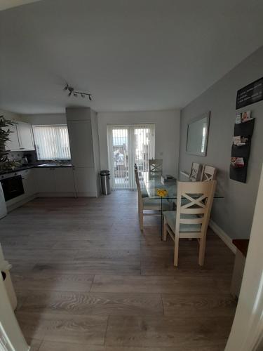 a kitchen and dining room with a table and chairs at Church House in Gainsborough