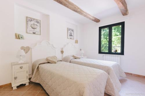 En eller flere senge i et værelse på Hotel - Ristorante Pintadera