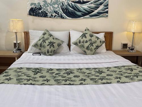Een bed of bedden in een kamer bij Umda Hotel Galaxy