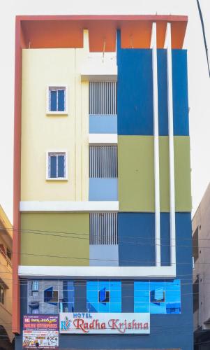 a building with colorful paint on the side of it at Hotel Radha Krishna in Visakhapatnam